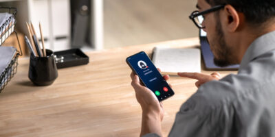 A man receiving a call from an unknown number.