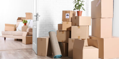 A pile of boxes in an empty room