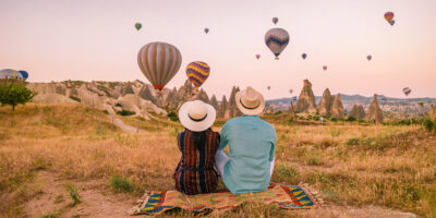 A couple watching hot air balloons in Turkey.