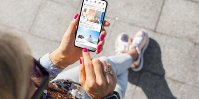 A woman looking at social media on her phone.